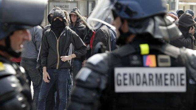 Anti-fascist activists confront police in Calais, northern France, Sunday, Sept 7, 2014