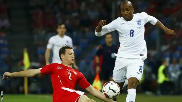 Switzerland's Stephan Lichtsteiner (left) and England's Fabian Delph