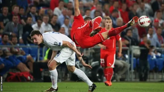 Haris Seferovic of Switzerland (right) and Phil Jones