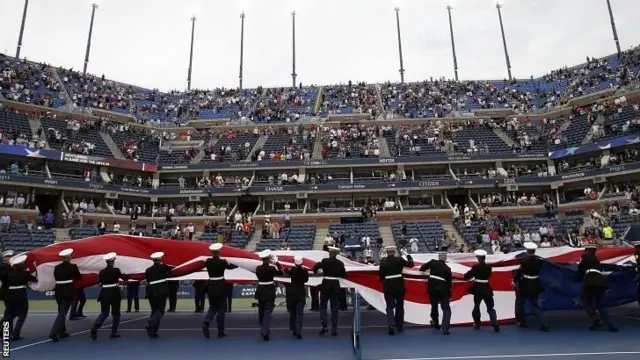 US Marines unfurl a large US flag during ceremonies