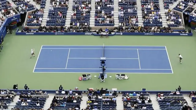 Kei Nishikori, of Japan, returns a shot against Marin Cilic, of Croatia