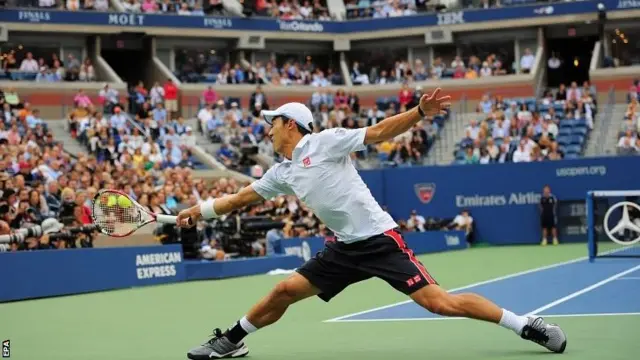 Kei Nishikori of Japan hits a return