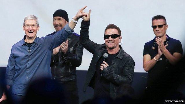 Apple CEO Tim Cook and U2