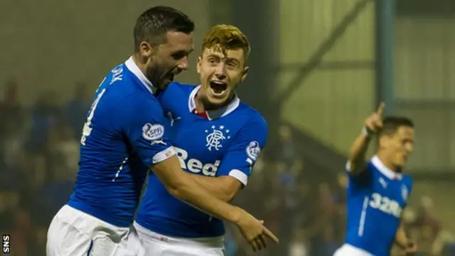 Nicky Clark (left) celebrates after opening the scoring for Rangers