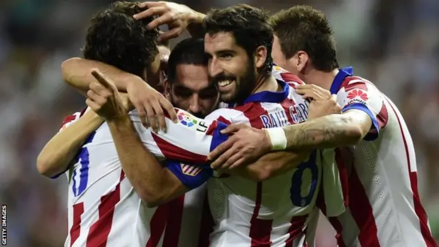 Arda Turan celebrates with his teammates