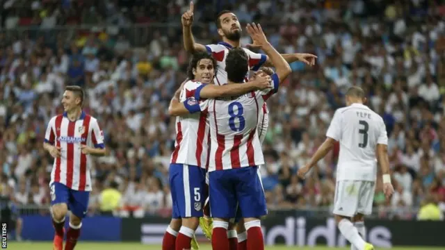 Arda Turan celebrates a goal against Real Madrid