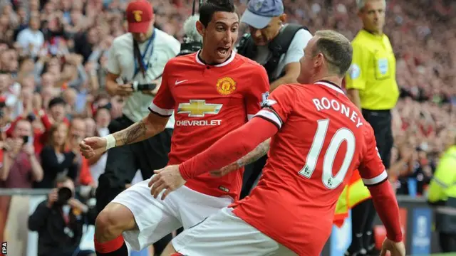 Angel Di Maria celebrates scoring the opening goal with Wayne Rooney