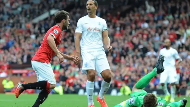 QPR's Rio Ferdinand looks on as Juan Mata scores for Manchester United