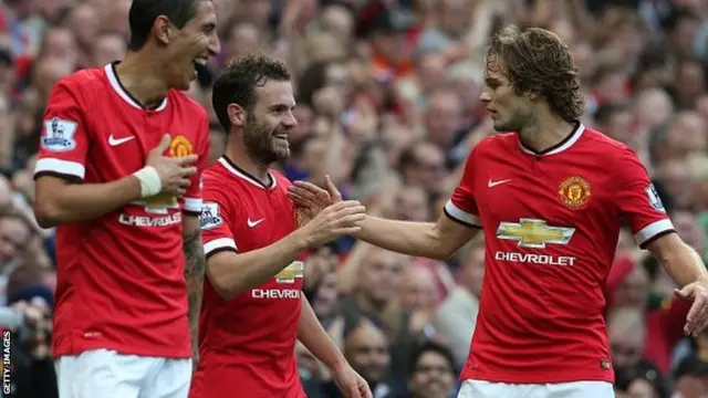 Juan Mata (centre) celebrates with Angel di Maria (left) and Daley Blind