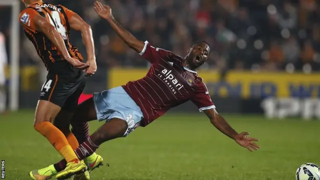 Hull's Jake Livermore brings down West Ham's Alex Song