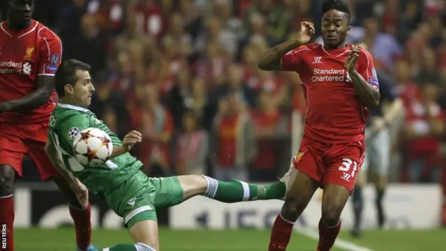 Liverpool's Raheem Sterling is challenged by Ludogorets' Aleksandar Aleksandrov