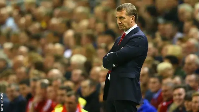 Brendan Rodgers, manager of Liverpool looks on