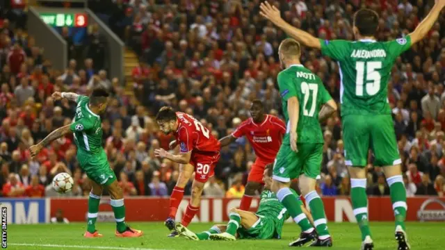 Adam Lallana of Liverpool shoots towards goal