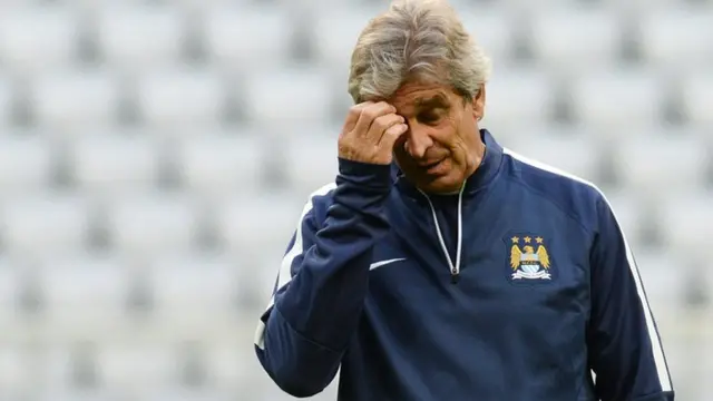 Manchester City manager Manuel Pellegrini scratches his head during training for the match against Bayern Munich