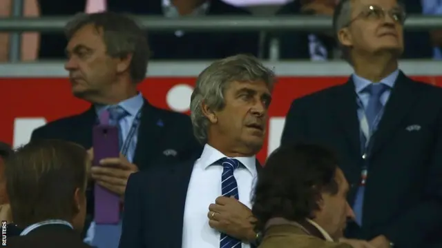 Manchester City manager Manuel Pellegrini watches from the stands at Bayern Munich