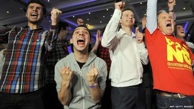 Pro-union supporters celebrate as Scottish independence referendum results come in at a "Better Together" event in Glasgow, Scotland