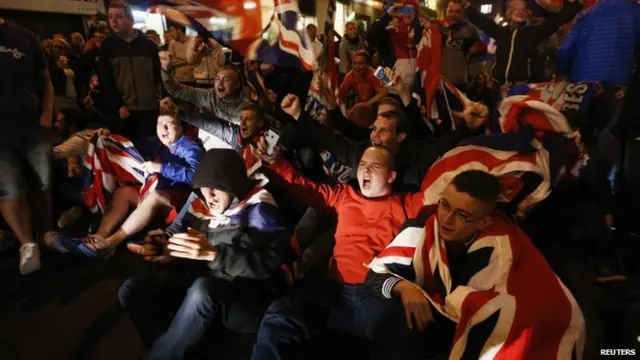 Pro-union protestors chant and wave Union Flags during a demonstration at George Square in Glasgow