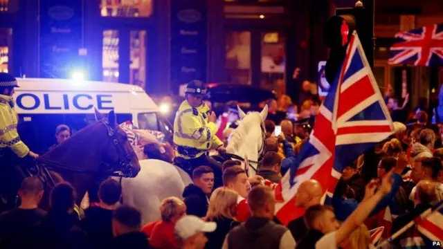 Pro-union protestors chant and wave Union Flags during a demonstration at George Square in Glasgow