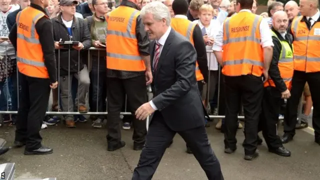 Stoke boss Mark Hughes arrives at Loftus Road