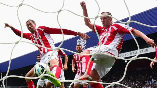 Peter Crouch appears to get a toe on the ball during QPR's equaliser