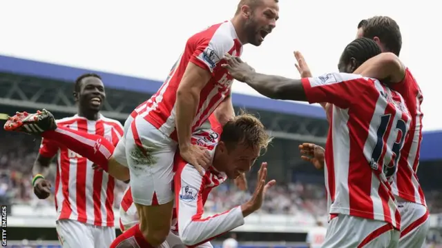 Stoke players celebrate Peter Crouch's goal against QPR