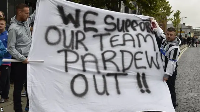 Newcastle United fans call for Alan Pardew's resignation with a home-made flag