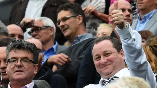 Newcastle United owner Mike Ashley smiles at the crowd