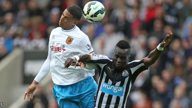 Hull's Curtis Davies wins the header against Newcastle