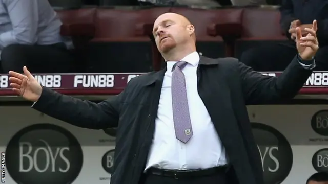 Burnley manager Sean Dyche throws his arms back