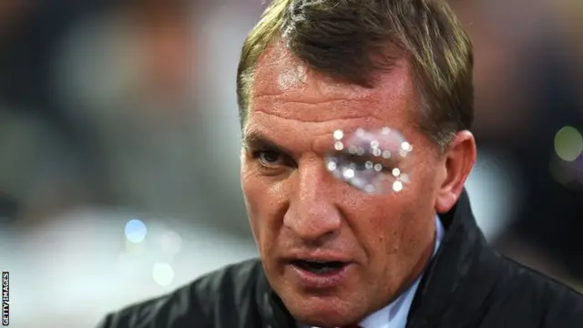 Liverpool manager Brendan Rodgers walks through the bubbles at Upton Park