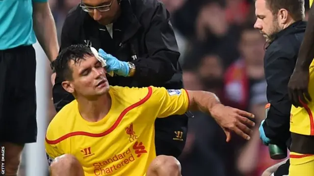 Dejan Lovren is treated by the Liverpool doctor