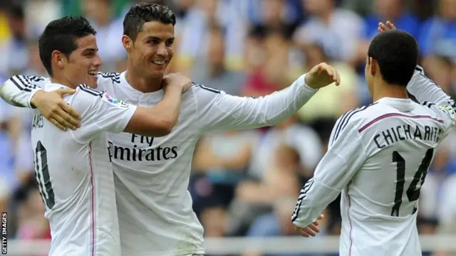 Real Madrid's Colombian midfielder James Rodriguez, Portuguese forward Cristiano Ronaldo and Mexican forward Javier Hernandez celebrate