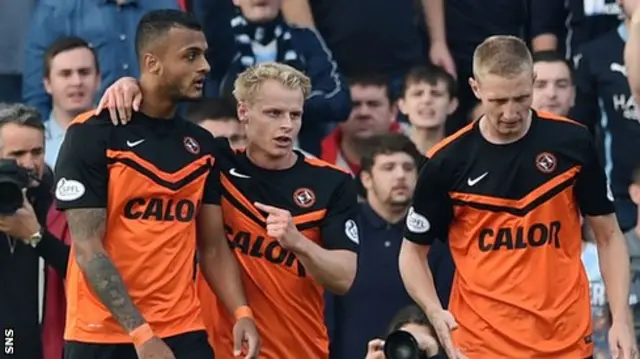 Mario Bilate (left) is congratulated by Gary Mackay-Steven