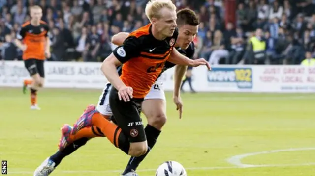 Gary Mackay-Steven goes down under a challenge from Thomas Konrad.