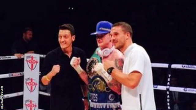 Mesut Ozil and Lukas Podolski with boxer George Groves