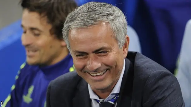 Chelsea manager Jose Mourinho smiles in the dugout