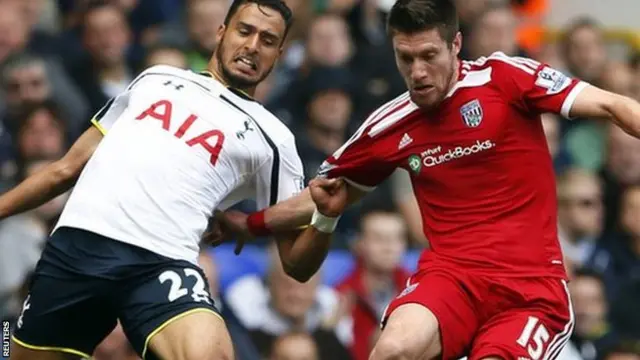 Tottenham's Nacer Chadli reaches for the ball against West Brom