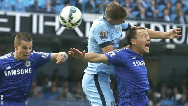 Manchester City striker Edin Dzeko heads wide