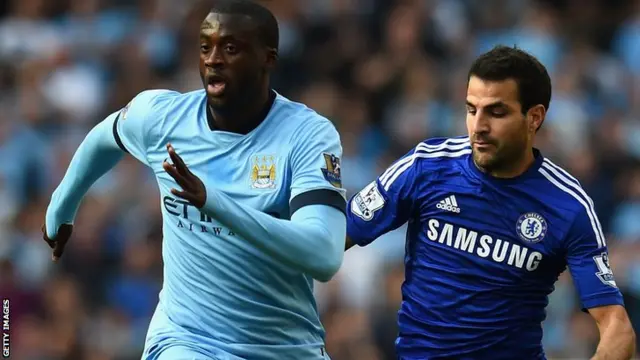 Manchester City's Yaya Toure outpaces Cesc Fabregas