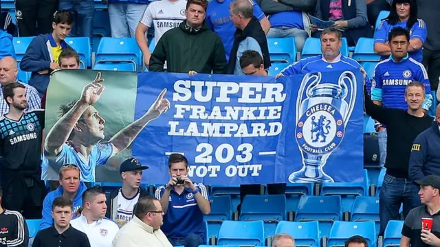 Chelsea fans hold a flag for Frank Lampard