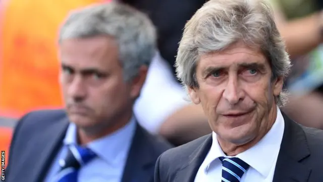 Jose Mourinho appears to glare at Manchester City manager Manuel Pellegrini