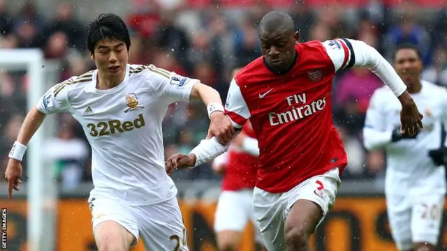 Abou Diaby playing for Arsenal