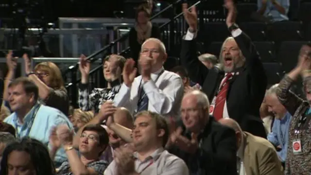 A group of delegates leading the standing ovation for Manuel Cortes