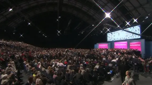 A wide shot of the conference hall