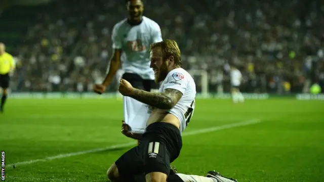 Johnny Russell celebrates his opening goal against Reading