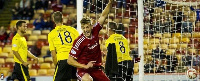 Ashton Taylor celebrates after his first goal for Aberdeen gave them an early lead against Livingston