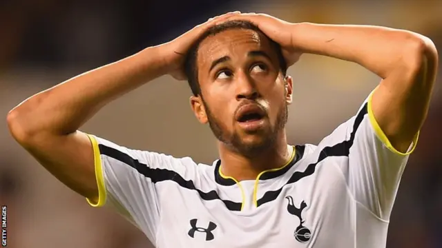 Tottenham Hotspur midfielder Andros Townsend looks at the scoreline