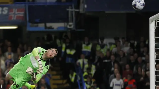 Bolton keeper Andy Lonergan saves Andre Schurrle's free-kick