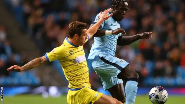 Manchester City's Bacary Sagna goes for the ball during their cup tie against Sheffield Wednesday