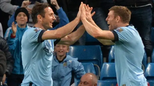 Manchester City's Frank Lampard celebrates his goal with James Milner